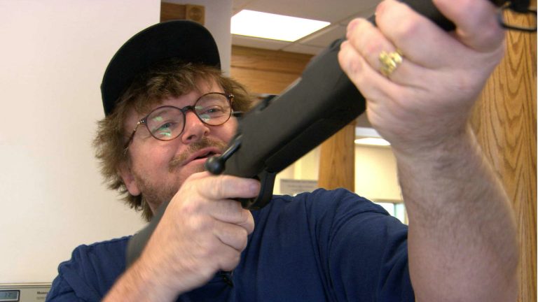 Don_t-you-think-its-a-little-dangerous-handing-out-guns-at-a-bank_-Michael-Moore-in-BOWLING-FOR-C-768x432.jpg